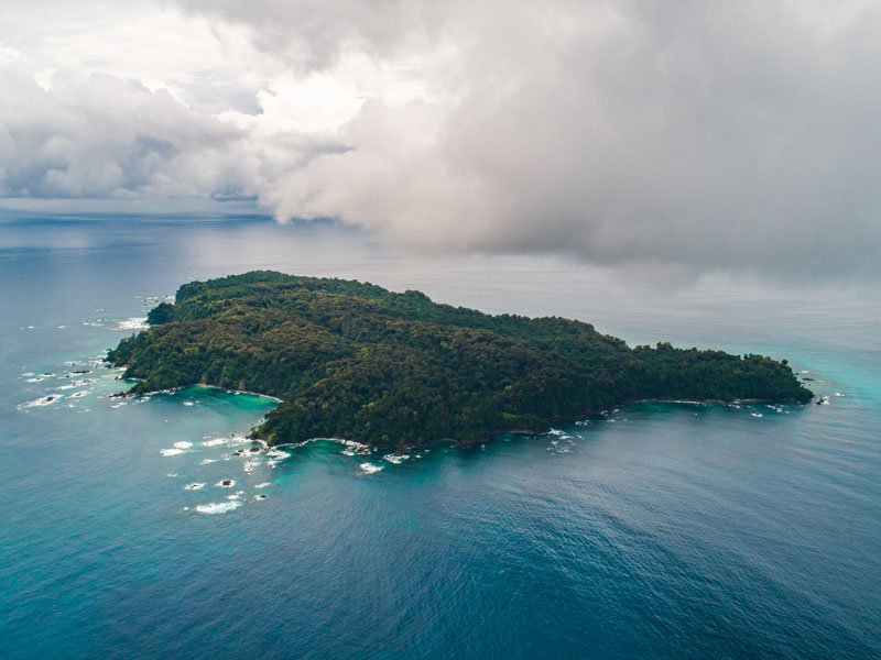 Aerial view of Isla del Caño Biological Reserve surrounded by the Pacific Ocean Costa Rica